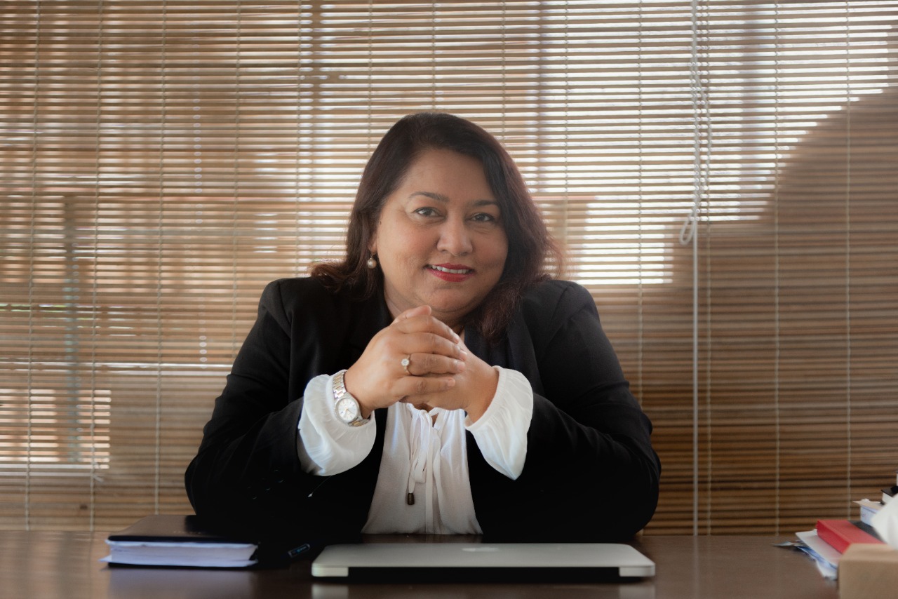 Me Mokshda Pertaub seated at her desk