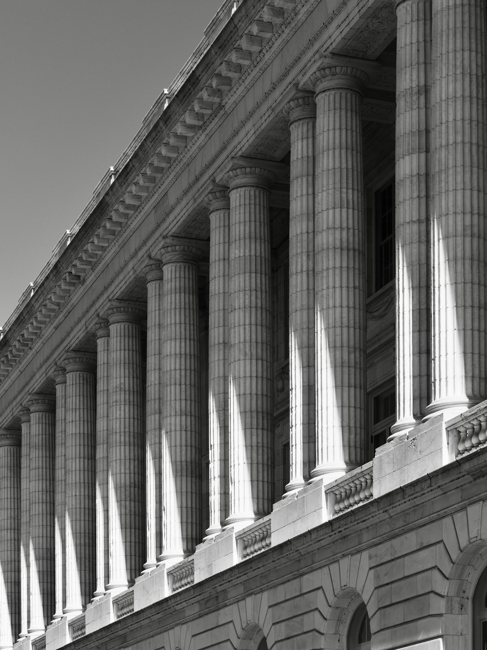 Stone courthouse columns seen from below