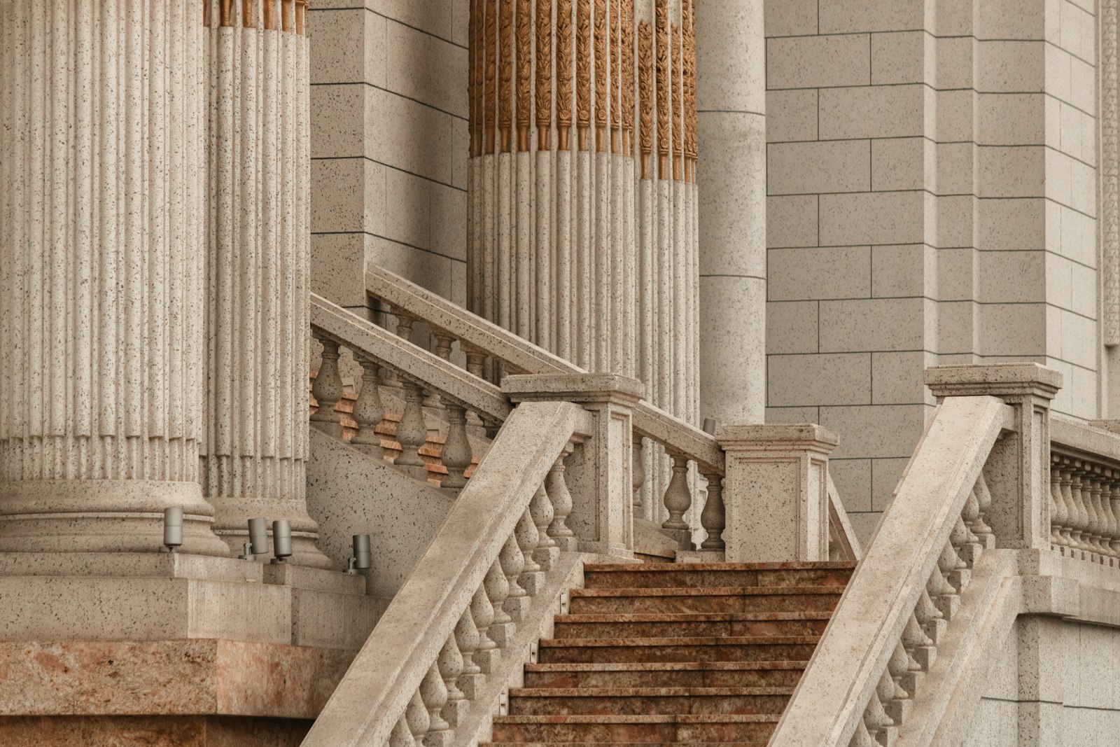 Wide stone steps leading up to the entrance of a courthouse