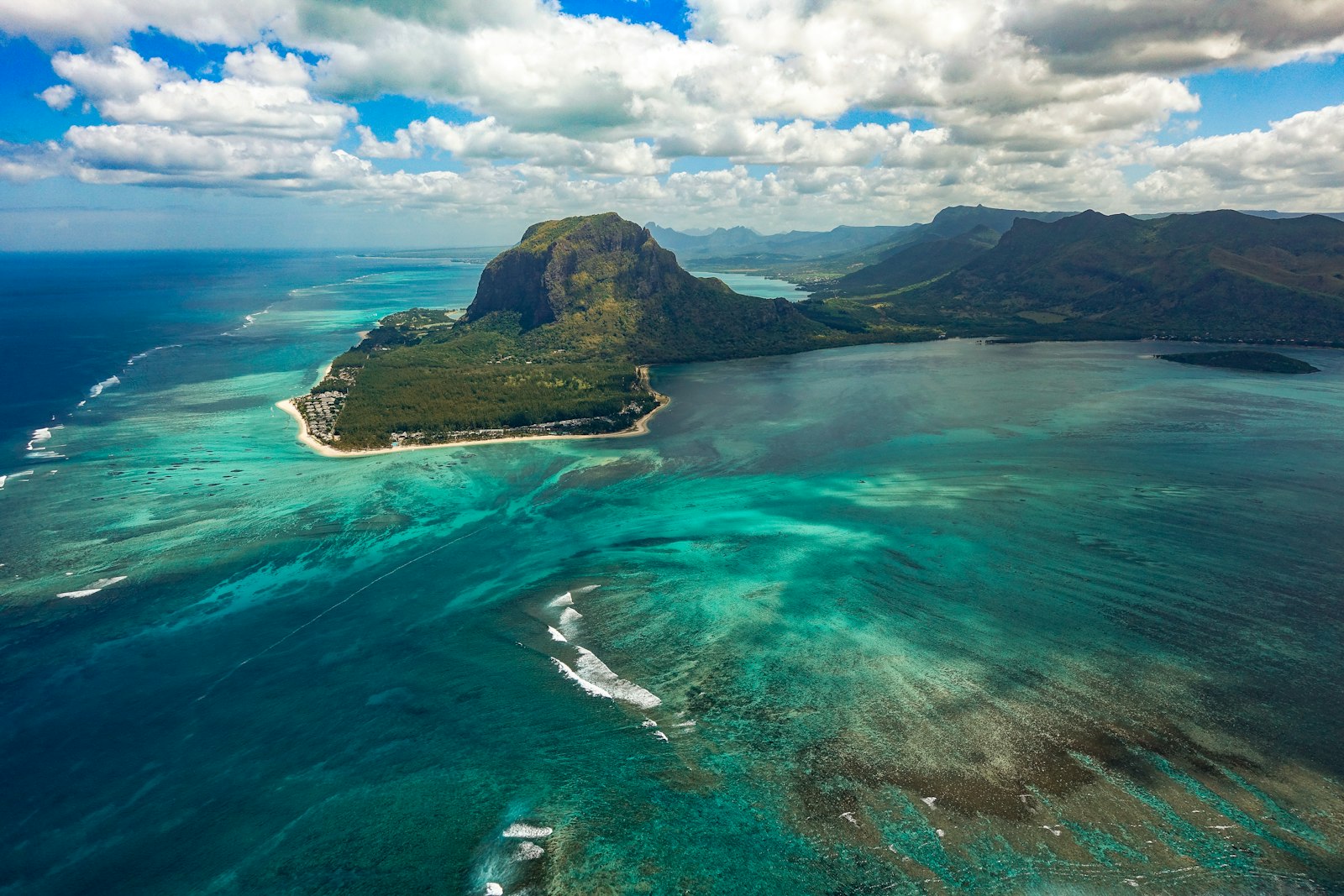 A Mauritian coastline with a mountain beyond the lagoon